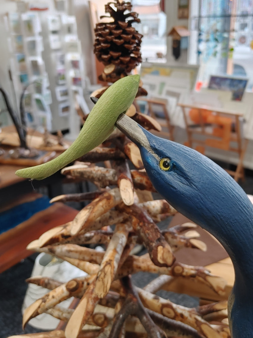 green-fish-in-herons-mouth-carved-wood