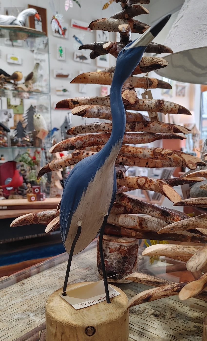 standing-blue-heron-on-wood